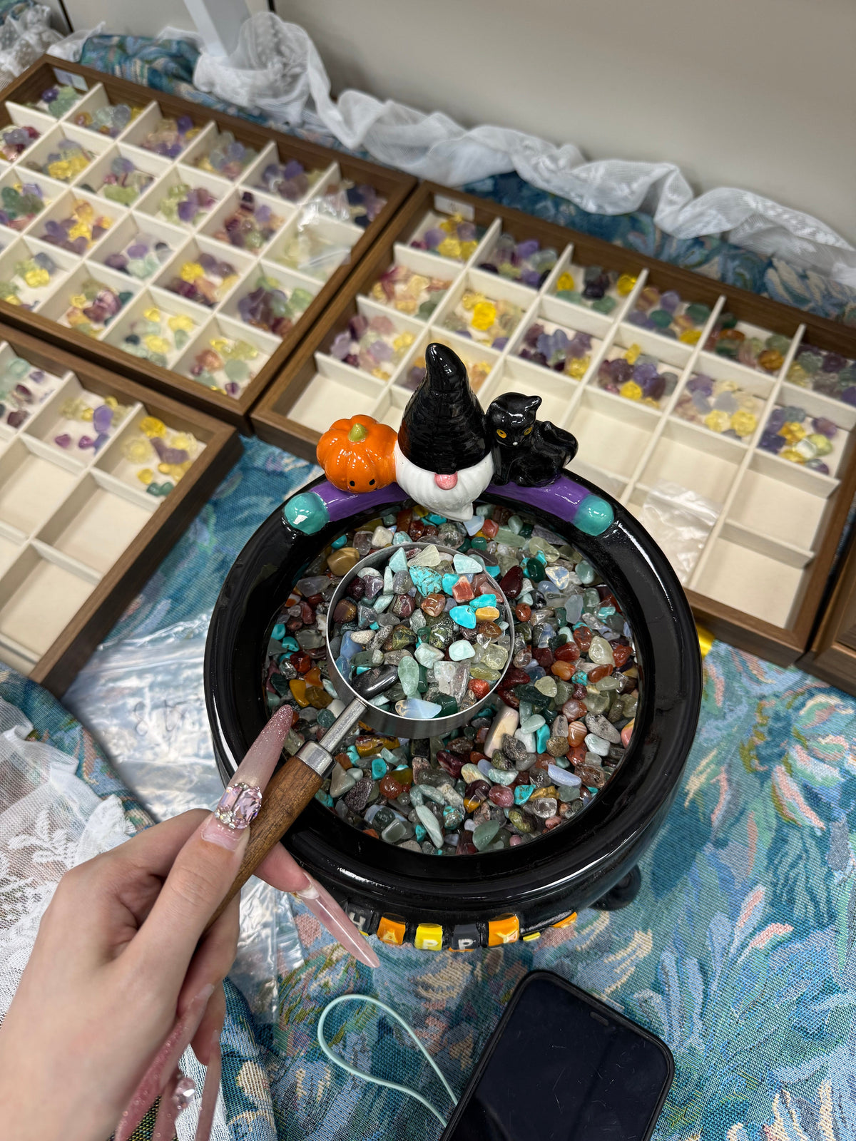 5 dollars per scoop. A mixture of different types of crushed stones, possibly with small decorative pieces as a surprise.