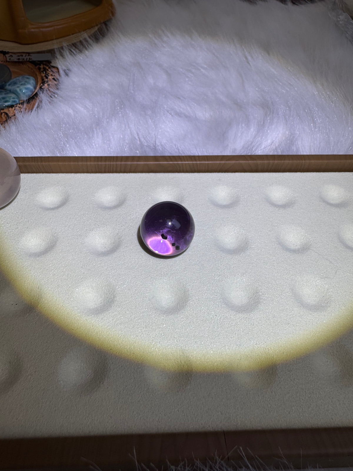 Amethyst and sea urchin fossils coexist in a sphere, with a size of 20.5mm