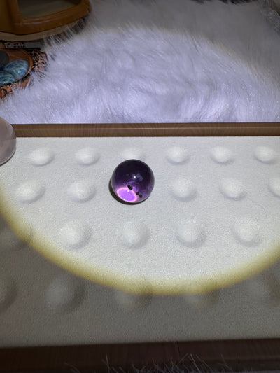 Amethyst and sea urchin fossils coexist in a sphere, with a size of 20.5mm