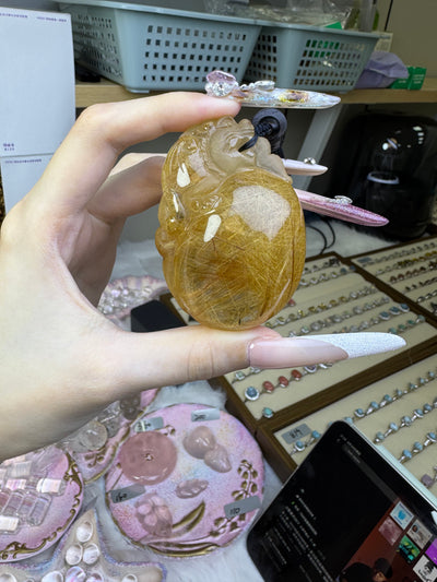 Golden rutilated pixiu carving handle piece, with dimensions of 67mm × 46.7mm