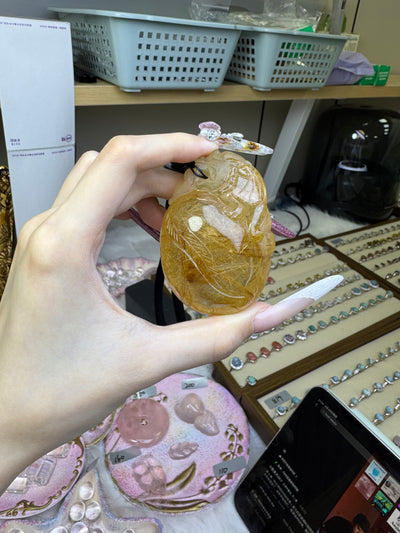 Golden rutilated pixiu carving handle piece, with dimensions of 67mm × 46.7mm