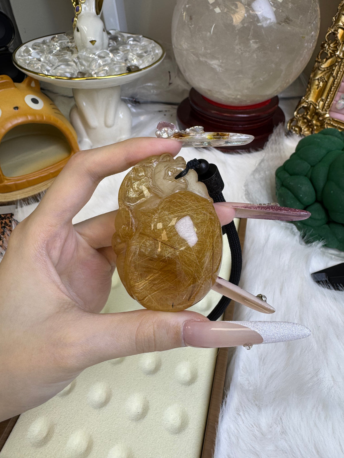 Golden rutilated pixiu carving handle piece, with dimensions of 67mm × 46.7mm